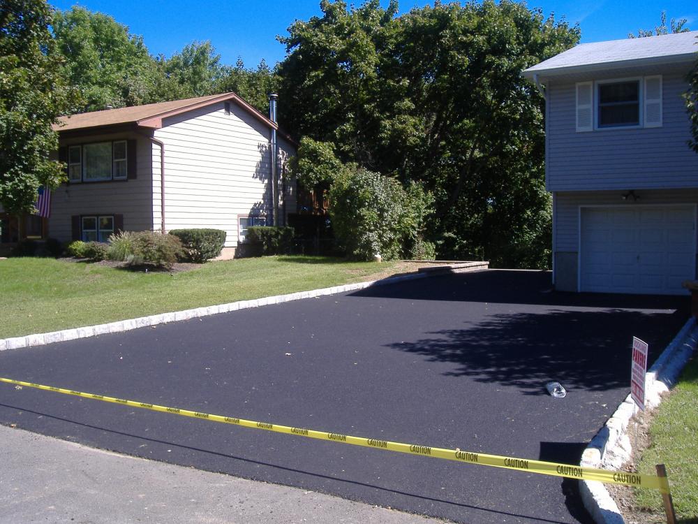 Repairing asphalt potholes